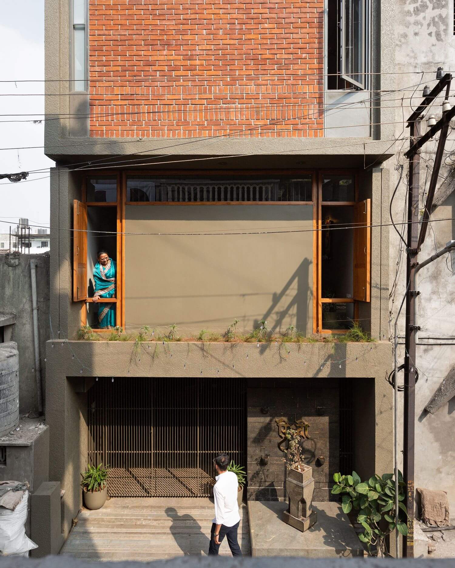 The narrow brick façade and timber windows