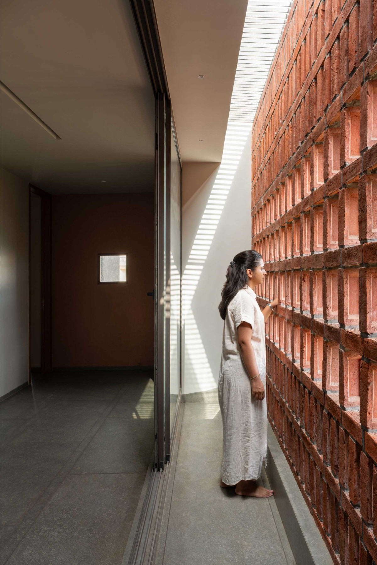 Sunlight filtered through the brick jali
